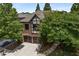 Charming two-story home with a brick facade, Tudor details, and a well-manicured front yard at 625 Society St, Alpharetta, GA 30022
