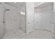 Modern bathroom featuring a glass-enclosed shower with white tile and chrome fixtures at 1094 Township Sq, Alpharetta, GA 30022
