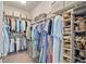 Organized walk-in closet with shelves, rods, and storage containers for maximum space at 1094 Township Sq, Alpharetta, GA 30022