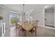 Elegant dining room with natural light and stylish furnishings for comfortable dining at 1094 Township Sq, Alpharetta, GA 30022