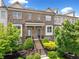Charming brick townhome with well-manicured landscaping and a welcoming entrance at 1094 Township Sq, Alpharetta, GA 30022