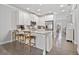 Modern kitchen with white cabinetry, granite countertops, and stainless steel appliances at 1094 Township Sq, Alpharetta, GA 30022