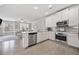 Bright, modern kitchen with stainless steel appliances, granite counters, and an open layout at 1094 Township Sq, Alpharetta, GA 30022