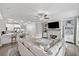 Open-concept living room featuring a fireplace, modern décor, and seamless flow to the kitchen at 1094 Township Sq, Alpharetta, GA 30022