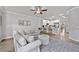 Cozy living room with a plush sofa and open access to the modern kitchen and eating area at 1094 Township Sq, Alpharetta, GA 30022