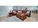The basement living area features a leather sectional sofa, rug, and recessed lights at 226 Nacoochee Dr, Woodstock, GA 30188