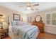 Cozy bedroom with wooden floors, lots of light and a bed at 226 Nacoochee Dr, Woodstock, GA 30188