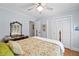 The bedroom features hardwood floors, a ceiling fan, and double door closet at 226 Nacoochee Dr, Woodstock, GA 30188