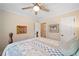 The bedroom features a ceiling fan, hardwood floors, and cream painted walls at 226 Nacoochee Dr, Woodstock, GA 30188