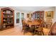 Traditional dining room with hardwood floors, a wooden table, and a china cabinet at 226 Nacoochee Dr, Woodstock, GA 30188