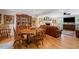 Traditional dining room featuring hardwood floors, a wooden table and chairs, and a large china cabinet at 226 Nacoochee Dr, Woodstock, GA 30188