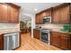 Gourmet kitchen featuring stainless appliances, granite countertops, and ample cabinet space for storage at 226 Nacoochee Dr, Woodstock, GA 30188
