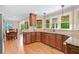 Well-appointed kitchen with stainless steel appliances and granite countertops adjoins a cozy dining space at 226 Nacoochee Dr, Woodstock, GA 30188