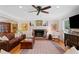 Spacious living room with a fireplace, hardwood floors, and plenty of natural light at 226 Nacoochee Dr, Woodstock, GA 30188