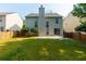 A spacious backyard with a large patio, perfect for outdoor entertaining at 306 Burdock Trce, Woodstock, GA 30188