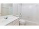 Bathroom with white tile, sink, and bathtub at 306 Burdock Trce, Woodstock, GA 30188