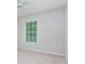 Bedroom with neutral carpet and a bright window at 306 Burdock Trce, Woodstock, GA 30188