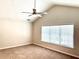 Inviting bedroom featuring a vaulted ceiling, ceiling fan, and window at 306 Burdock Trce, Woodstock, GA 30188