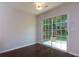 Dining area with sliding glass door leading to the patio at 306 Burdock Trce, Woodstock, GA 30188