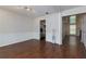 Spacious dining room with hardwood floors, and elegant wainscoting detail at 306 Burdock Trce, Woodstock, GA 30188