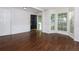 Bright living room featuring lots of natural light from the bay windows, hardwood floors at 306 Burdock Trce, Woodstock, GA 30188