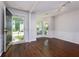 Inviting living room with lots of natural light, white walls, and hardwood floors at 306 Burdock Trce, Woodstock, GA 30188