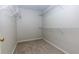 Walk-in closet with ample shelving and storage space at 306 Burdock Trce, Woodstock, GA 30188