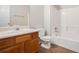 Bathroom features a vanity, laminate floors, and a white tub-shower combination at 4400 Old Allgood Cir, Stone Mountain, GA 30083