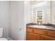 Bathroom features a granite countertop, wood cabinets, and a large mirror at 4400 Old Allgood Cir, Stone Mountain, GA 30083