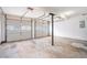 Spacious two-car garage with concrete flooring and overhead lighting offering ample storage and parking space at 4400 Old Allgood Cir, Stone Mountain, GA 30083