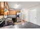 Functional kitchen featuring wood cabinets, stainless steel appliances, and a view to a separate door at 4400 Old Allgood Cir, Stone Mountain, GA 30083