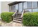 Back porch featuring wooden steps surrounded by lush greenery at 5509 Park S Pl, Atlanta, GA 30349