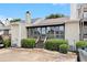 The back of house features an enclosed porch area with plenty of greenery and an AC unit at 5509 Park S Pl, Atlanta, GA 30349