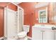 Bathroom featuring a tiled shower with glass door, sink with white vanity, and a modern mirror at 5509 Park S Pl, Atlanta, GA 30349
