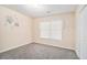Bedroom featuring neutral carpet, light walls, and a window with blinds at 5509 Park S Pl, Atlanta, GA 30349