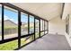 Enclosed sunroom with large windows providing ample natural light and outdoor views at 5509 Park S Pl, Atlanta, GA 30349