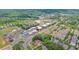 Aerial view of a neighborhood with diverse housing and commercial buildings at 1206 Red Fox Cir, Woodstock, GA 30188