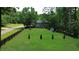 Expansive backyard featuring a lush lawn and a charming two-story home at 1206 Red Fox Cir, Woodstock, GA 30188