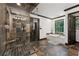 Spacious bathroom featuring a stone shower with a built-in seat and a soaking tub by the window at 1206 Red Fox Cir, Woodstock, GA 30188