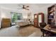 Cozy bedroom with comfortable bed, dark trim, and a large window at 1206 Red Fox Cir, Woodstock, GA 30188