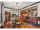 Cozy dining room with wood table, chairs, and dark trim with hardwood floors at 1206 Red Fox Cir, Woodstock, GA 30188