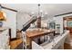 Charming dining room with a large wooden table, a staircase, and lots of natural light at 1206 Red Fox Cir, Woodstock, GA 30188