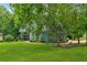 Charming home with well-manicured lawn and mature trees at 1206 Red Fox Cir, Woodstock, GA 30188