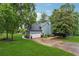 Charming two-story home with attached garage and well-maintained lawn at 1206 Red Fox Cir, Woodstock, GA 30188