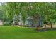 Charming home with well-manicured lawn and mature trees at 1206 Red Fox Cir, Woodstock, GA 30188