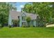Charming home with a beautiful front yard, well-manicured lawn, and a welcoming entrance at 1206 Red Fox Cir, Woodstock, GA 30188