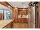 Kitchen area with stainless steel appliances and hardwood cabinets with hardwood floors at 1206 Red Fox Cir, Woodstock, GA 30188