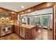 Kitchen area with stainless steel appliances and view to the dining room with hardwood floors at 1206 Red Fox Cir, Woodstock, GA 30188