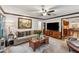 Inviting living room featuring a cozy couch, stylish coffee table, and a large-screen TV at 1206 Red Fox Cir, Woodstock, GA 30188
