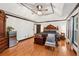 Elegant bedroom with hardwood floors, tray ceilings, and ample natural light at 1206 Red Fox Cir, Woodstock, GA 30188